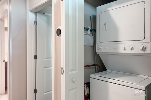 washroom featuring stacked washer and dryer