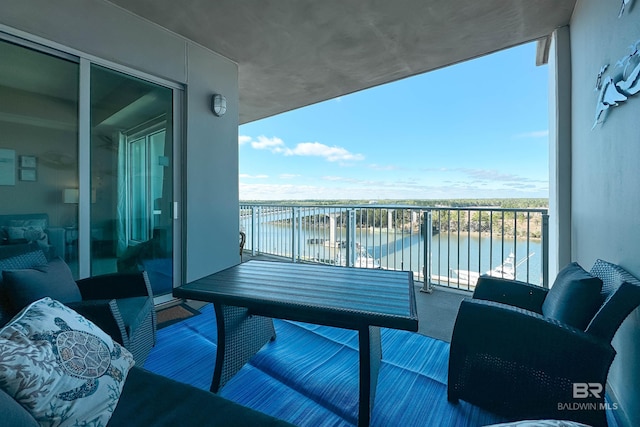 balcony featuring a water view