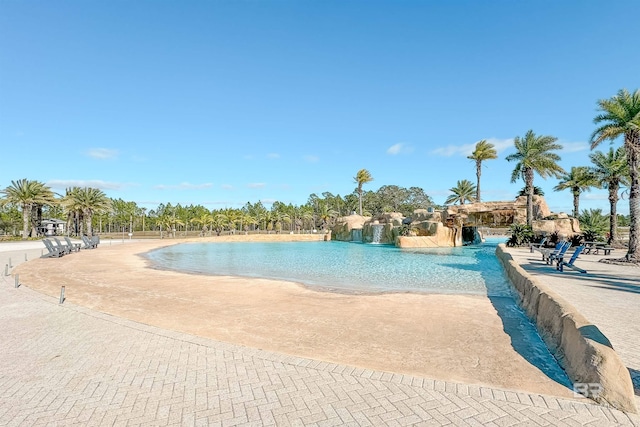 view of pool featuring pool water feature