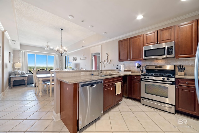 kitchen featuring pendant lighting, backsplash, appliances with stainless steel finishes, light tile patterned flooring, and sink