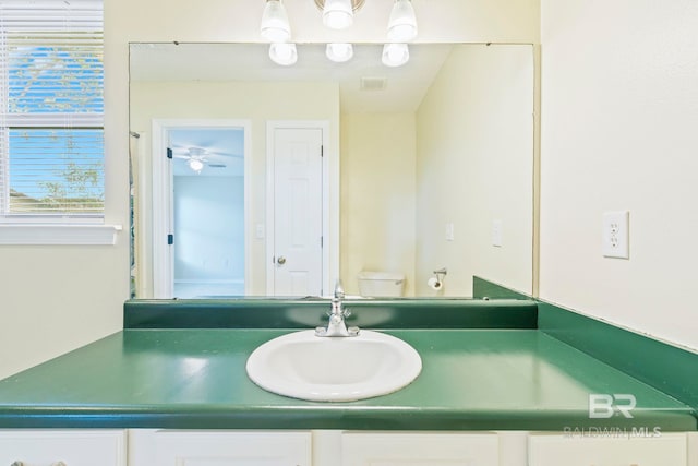 bathroom with vanity and toilet