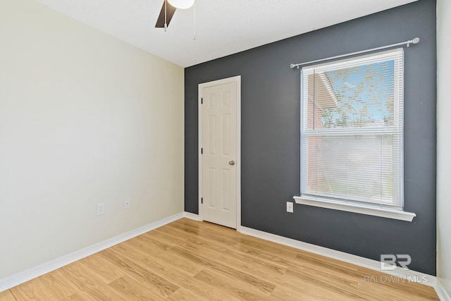 unfurnished room featuring light hardwood / wood-style floors and ceiling fan