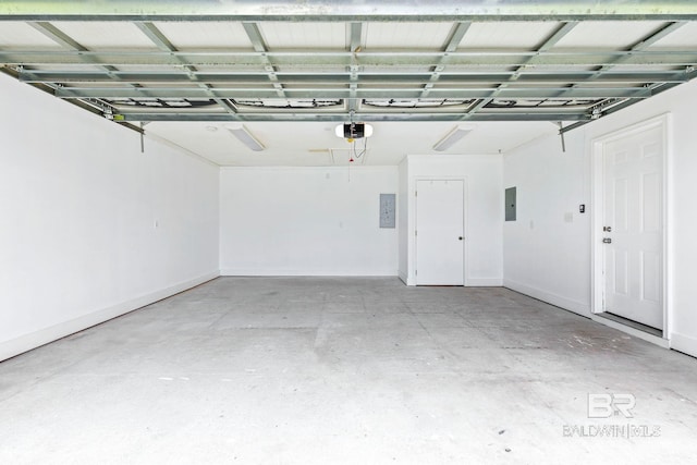 garage featuring a garage door opener and electric panel