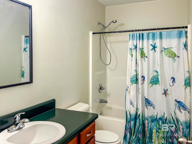 full bathroom with vanity, shower / tub combo, toilet, and a textured ceiling