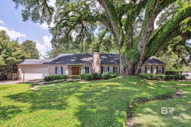 ranch-style house with a front yard and a garage