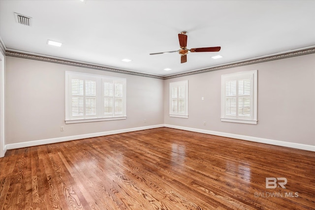 spare room featuring ceiling fan, ornamental molding, and hardwood / wood-style flooring