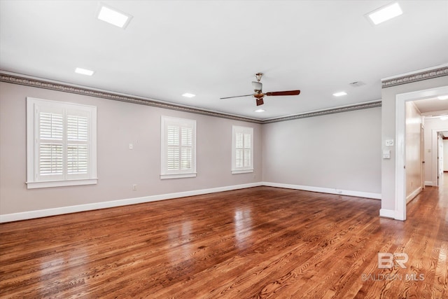 unfurnished room featuring hardwood / wood-style floors, ceiling fan, and ornamental molding