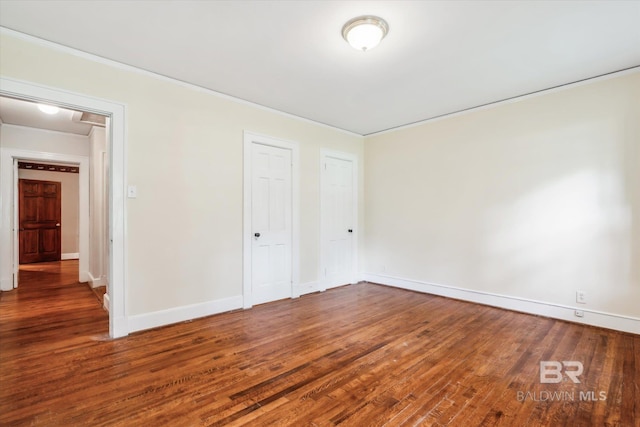 unfurnished bedroom featuring hardwood / wood-style flooring