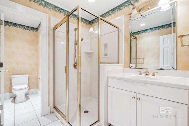 bathroom with tile patterned floors, vanity, toilet, and a shower with door