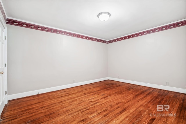 empty room with wood-type flooring