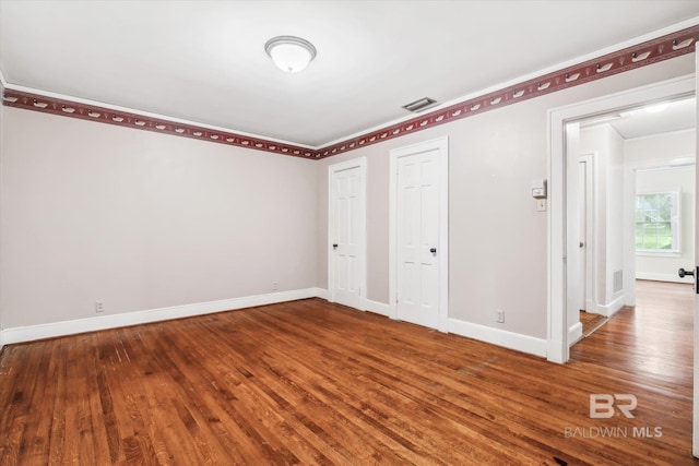 unfurnished bedroom featuring hardwood / wood-style floors