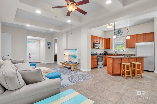 1430 Regency Rd Unit G101, Gulf Shores, AL 36542 - living room with a tray ceiling, ceiling fan, and recessed lighting