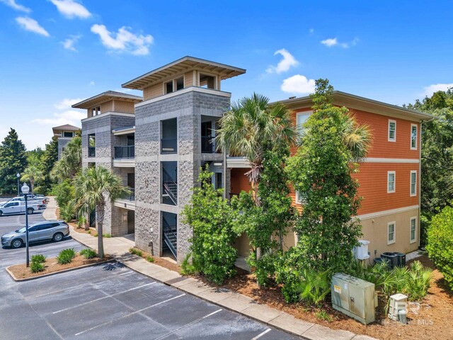 1430 Regency Rd Unit G101, Gulf Shores, AL 36542 - view of apartment building / complex featuring uncovered parking