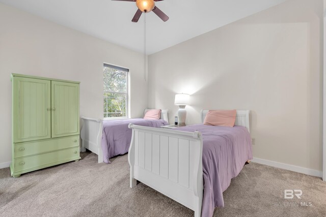 1430 Regency Rd Unit G101, Gulf Shores, AL 36542 - bedroom featuring light carpet and a ceiling fan