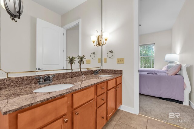 1430 Regency Rd Unit G101, Gulf Shores, AL 36542 - ensuite bathroom featuring double vanity and tile patterned flooring
