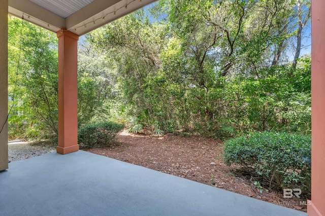 1430 Regency Rd Unit G101, Gulf Shores, AL 36542 - view of patio with a forest view