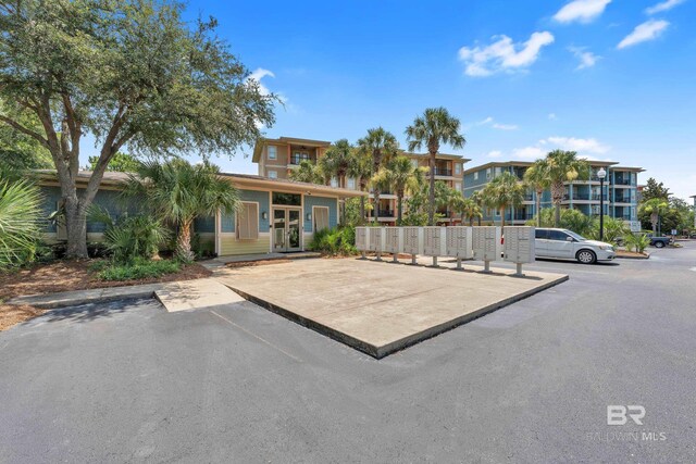 1430 Regency Rd Unit G101, Gulf Shores, AL 36542 - view of front facade featuring uncovered parking
