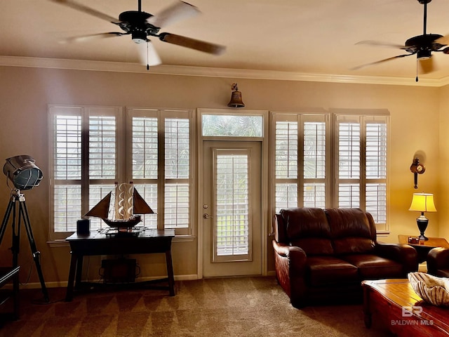 living room with crown molding, carpet floors, and ceiling fan