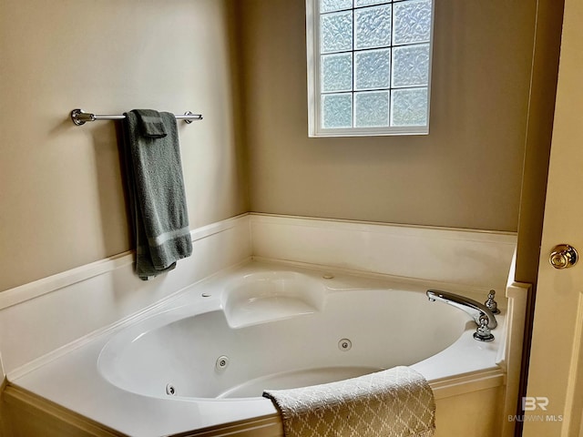 bathroom with a tub to relax in