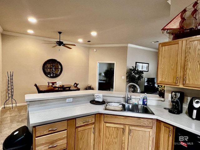 kitchen with ceiling fan, kitchen peninsula, sink, and ornamental molding