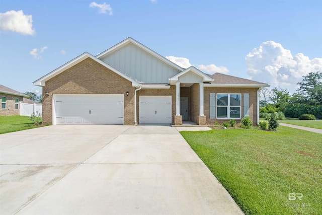 craftsman-style home featuring a garage and a front lawn