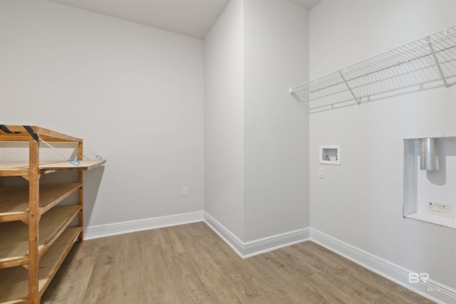 laundry area featuring hardwood / wood-style floors and washer hookup