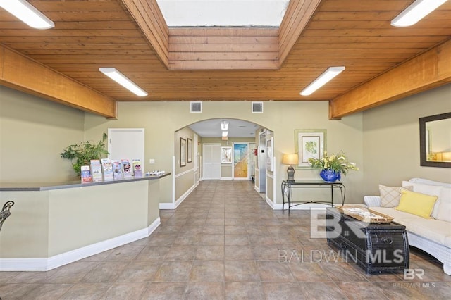 welcome area featuring arched walkways and visible vents