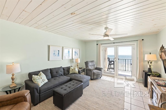 living room with wooden ceiling, french doors, ceiling fan, and light tile patterned floors
