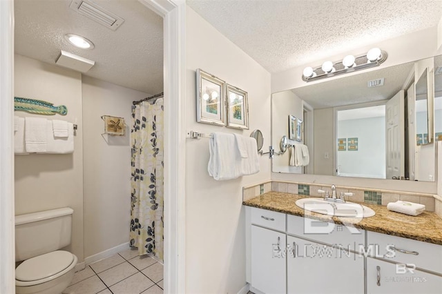 full bathroom with tile patterned floors, visible vents, a textured ceiling, and toilet