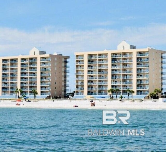 property view of water featuring a beach view