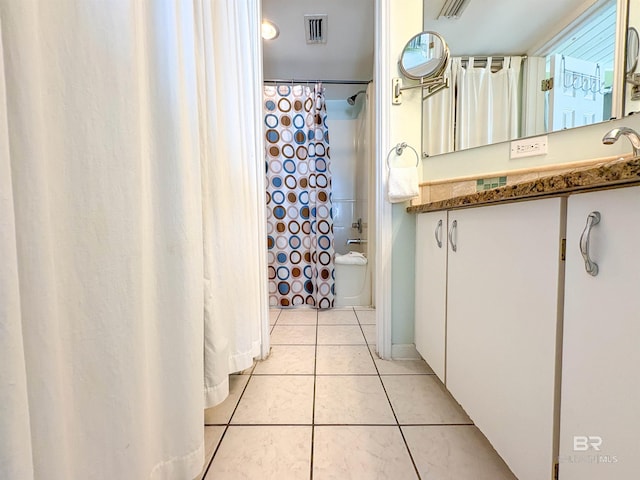 full bath featuring shower / bath combo, tile patterned flooring, visible vents, and vanity
