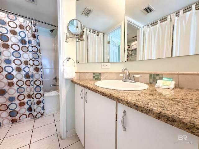 full bathroom featuring tile patterned floors, visible vents, and vanity