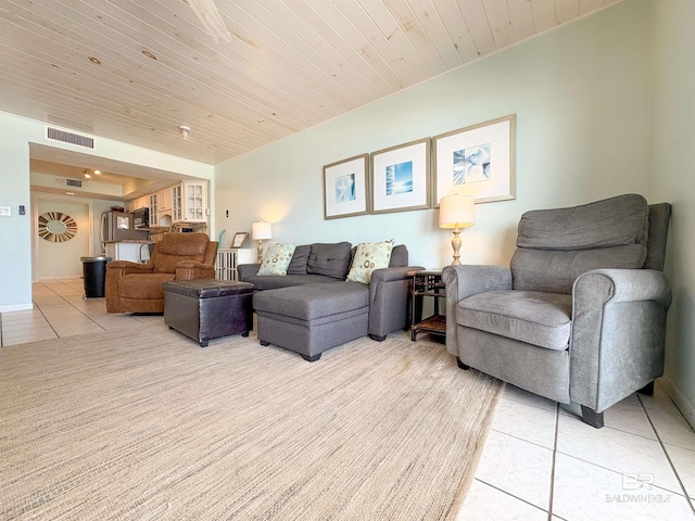 living room with wooden ceiling, visible vents, and light tile patterned floors
