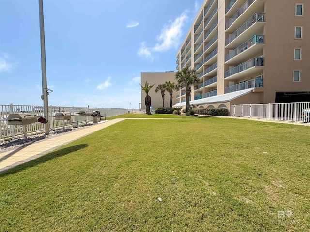 view of property's community with a yard
