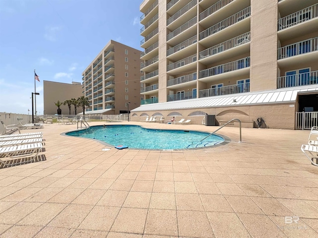 community pool featuring a patio area