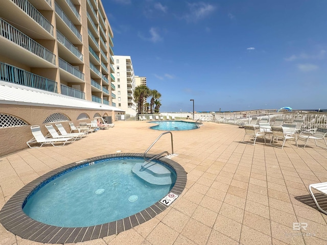 community pool featuring a patio area