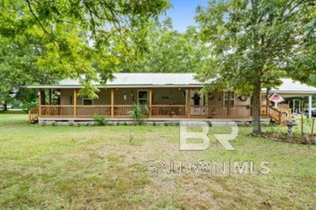 view of front of home featuring covered porch and a front lawn