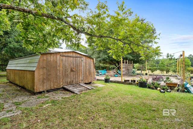 exterior space with a shed