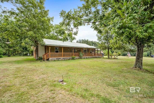 view of yard featuring covered porch