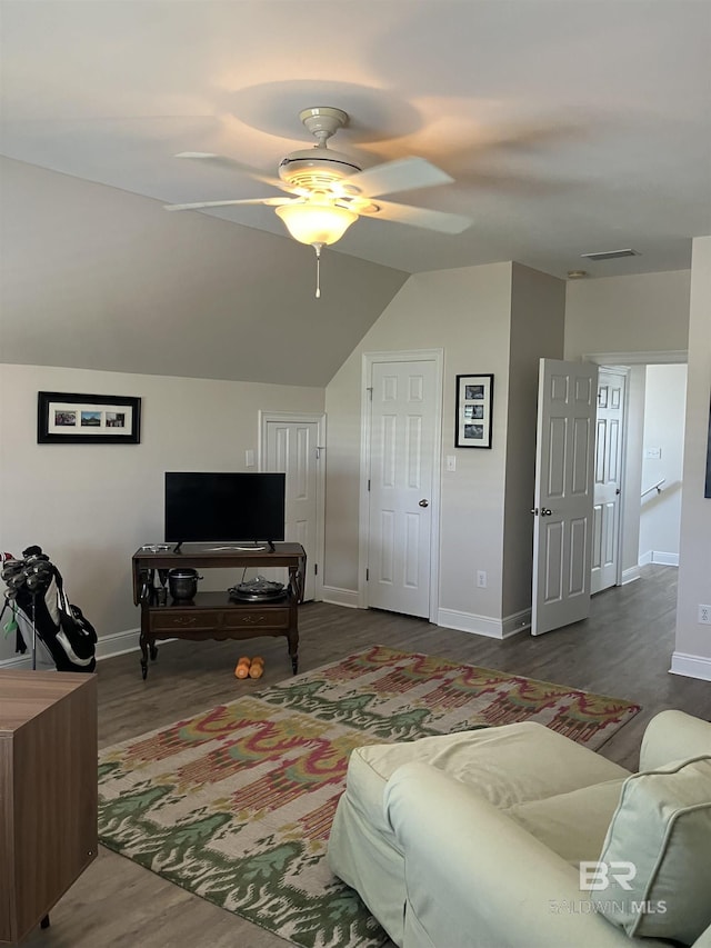 living room with hardwood / wood-style floors, ceiling fan, and lofted ceiling