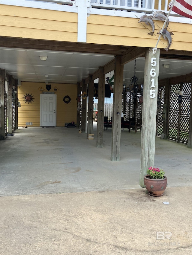 garage featuring a carport