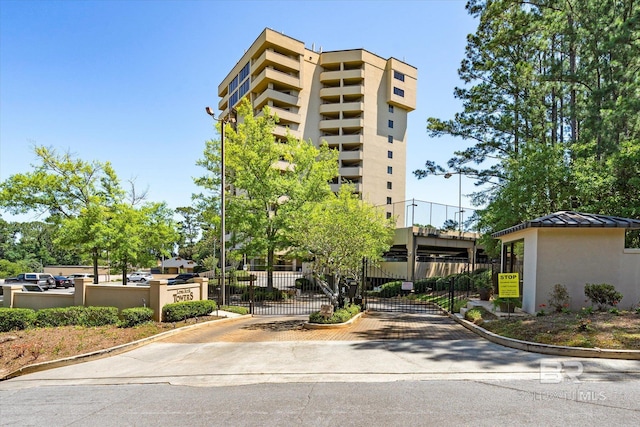 view of property with fence