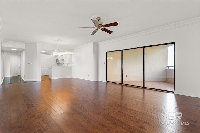 unfurnished living room with ceiling fan with notable chandelier, hardwood / wood-style floors, baseboards, and crown molding