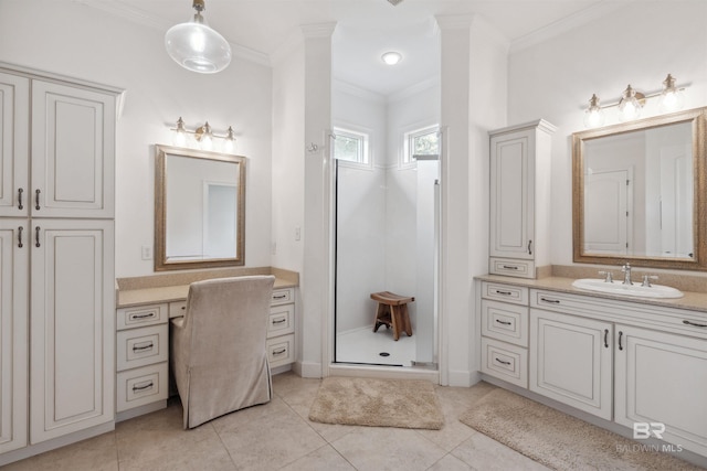 bathroom featuring tile patterned flooring, ornamental molding, a shower with door, and vanity