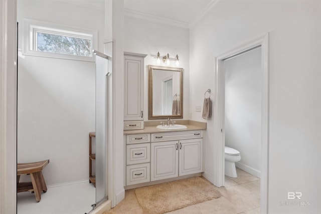 bathroom featuring ornamental molding, vanity, tile patterned floors, and toilet