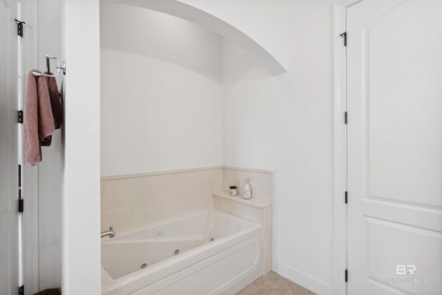 bathroom with a tub to relax in