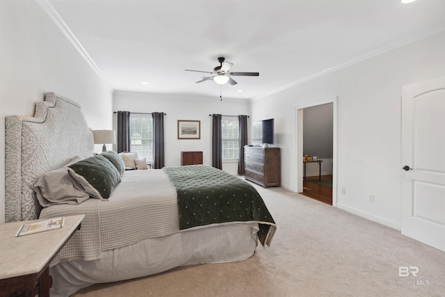 carpeted bedroom featuring crown molding and ceiling fan