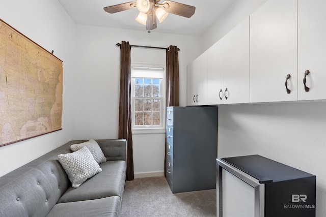 interior space with ceiling fan