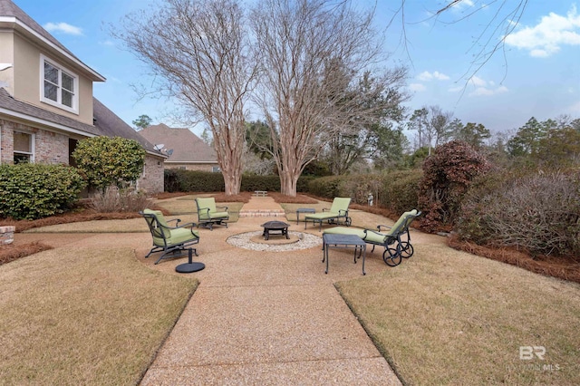 view of patio / terrace with a fire pit