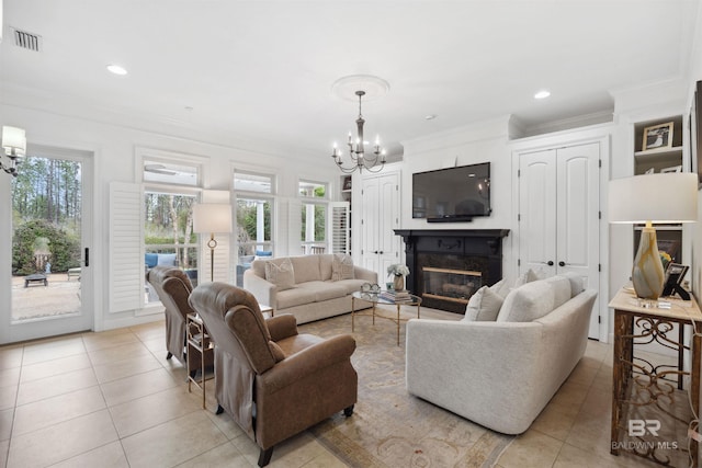 tiled living room with crown molding and an inviting chandelier